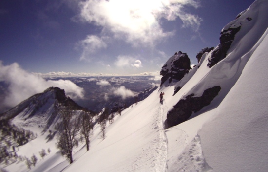 A skier finds their line from the summit of the Crown Jewel